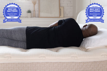 african american man laying on his side on top of the lytton mattress